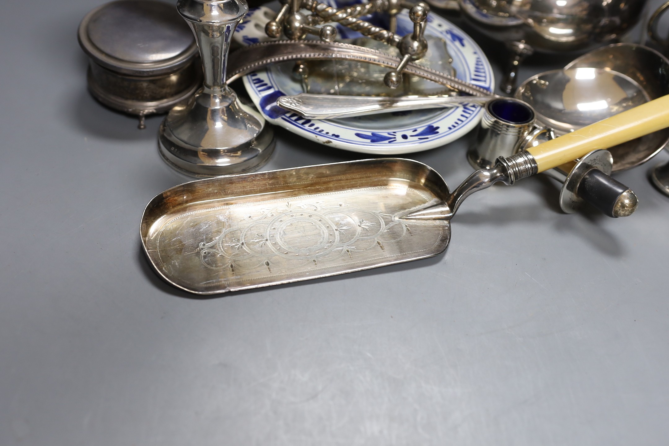 Assorted plated ware including a claret jug, teapot, sauce tureen, a pair of silver mounted dwarf candlesticks(a.f.) etc.